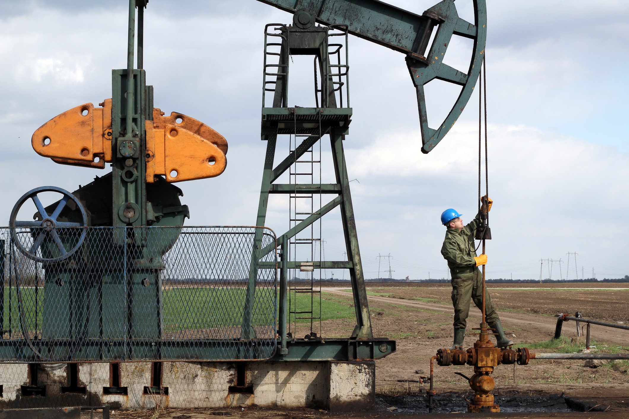 Worker at a pumpjack