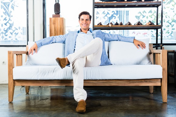 Man sitting on white couch