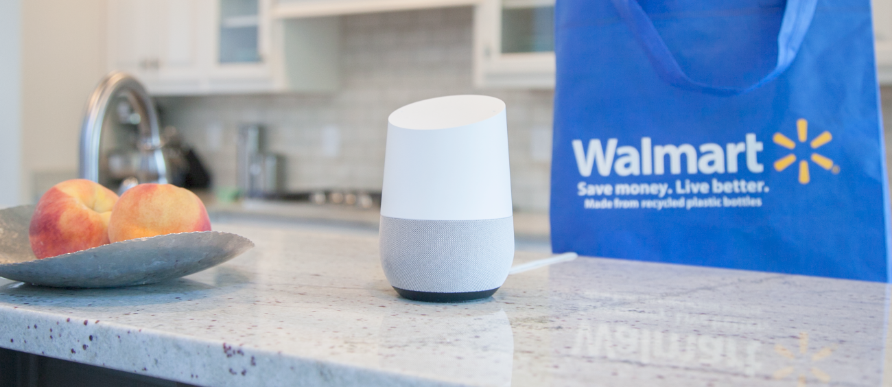 A Google Home smart speaker and a Walmart shopping bag on a kitchen counter.