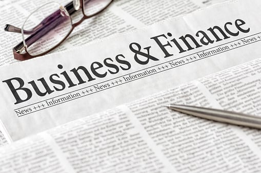 Close-up of business and finance newspaper section.