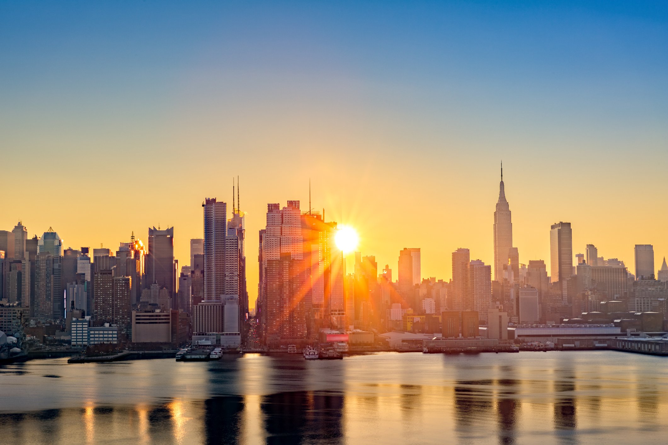 Sunrise over New York City skyline.