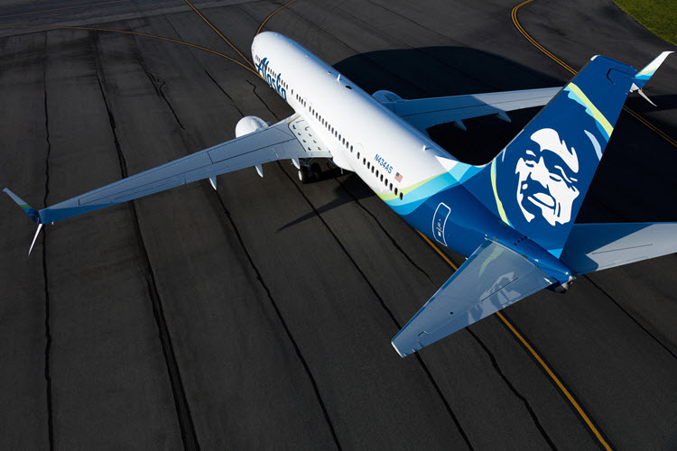 Alaska Airlines with updated blue and white livery on tarmac.