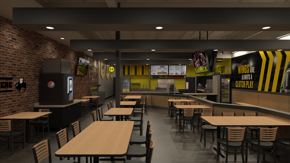 Dining area with tables and chairs at a B-Dubs Express restaurant location.