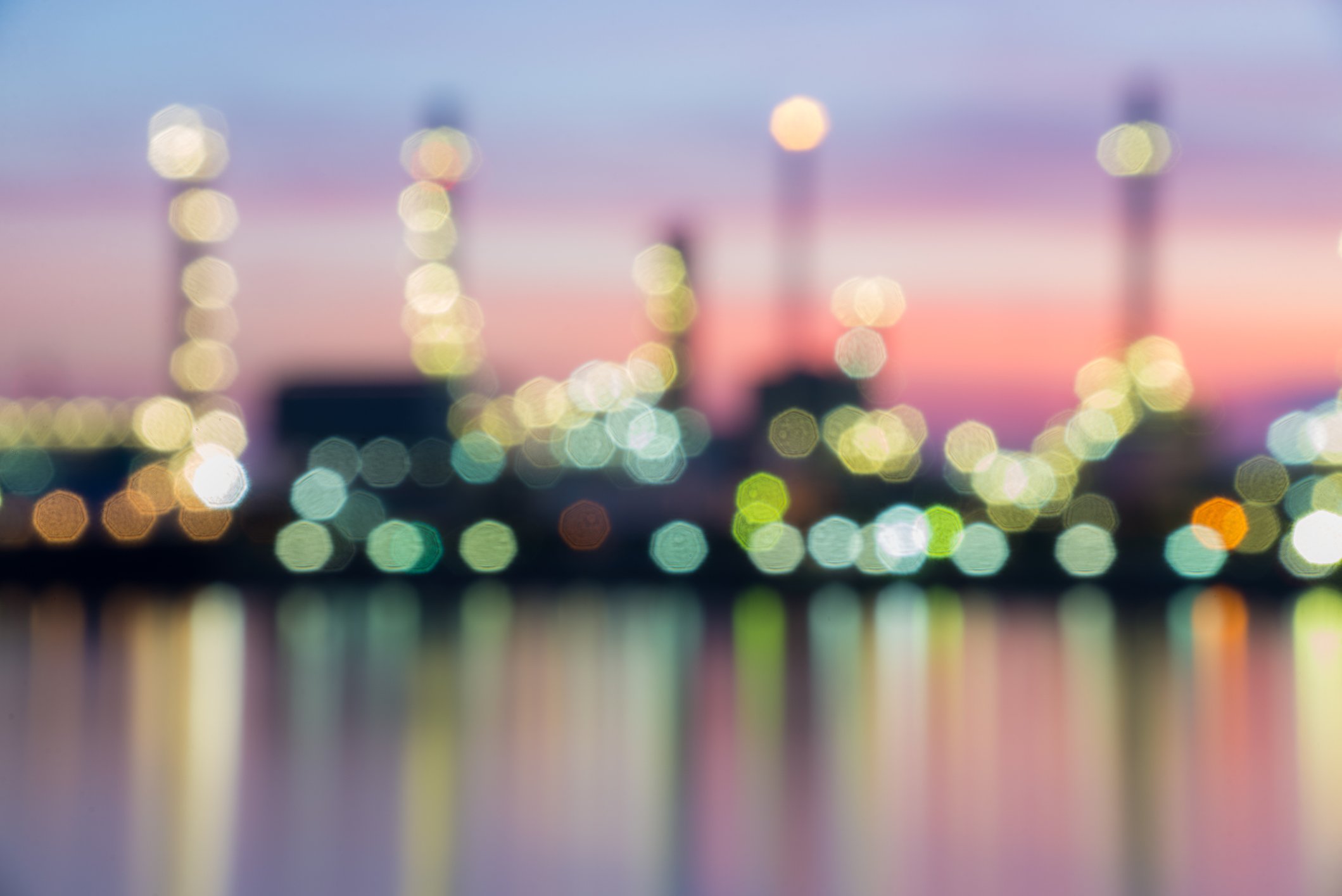 blurry picture of a refinery at dusk.
