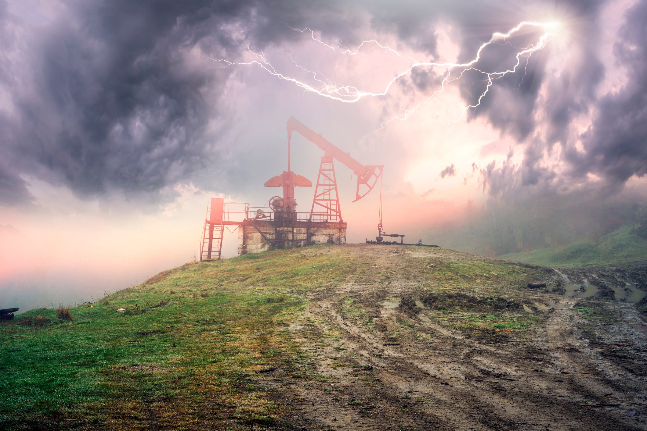 An oil pump with a storm overhead.