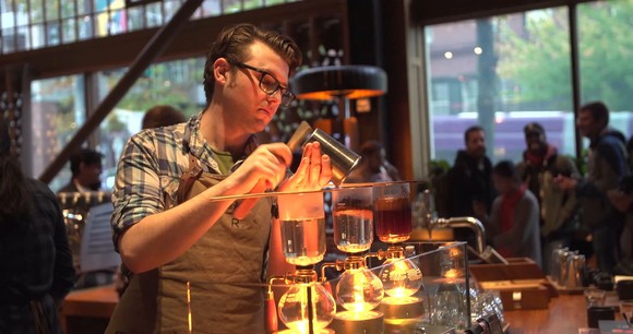 Starbucks Roastery barista making several coffee drinks.