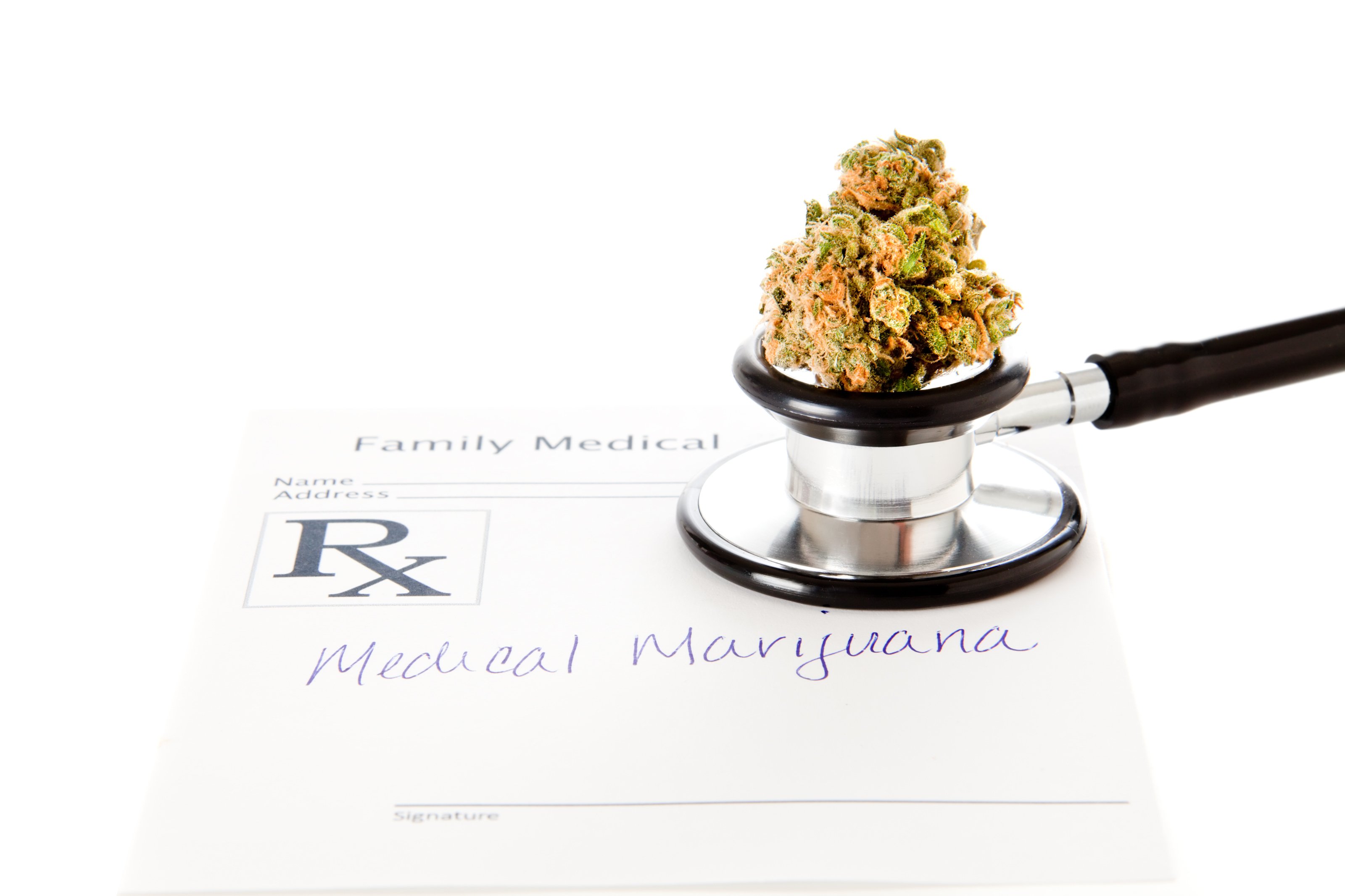 Marijuana bud with stethoscope and prescription script