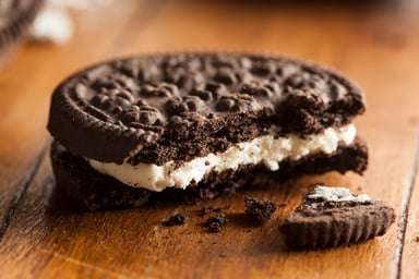 Broken chocolate cookie with cream filling