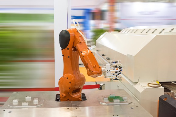 A robotic arm on an assembly line.