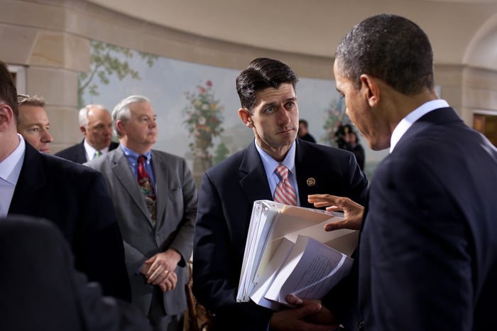 Former President Barack Obama speaking with House Speaker Paul Ryan.