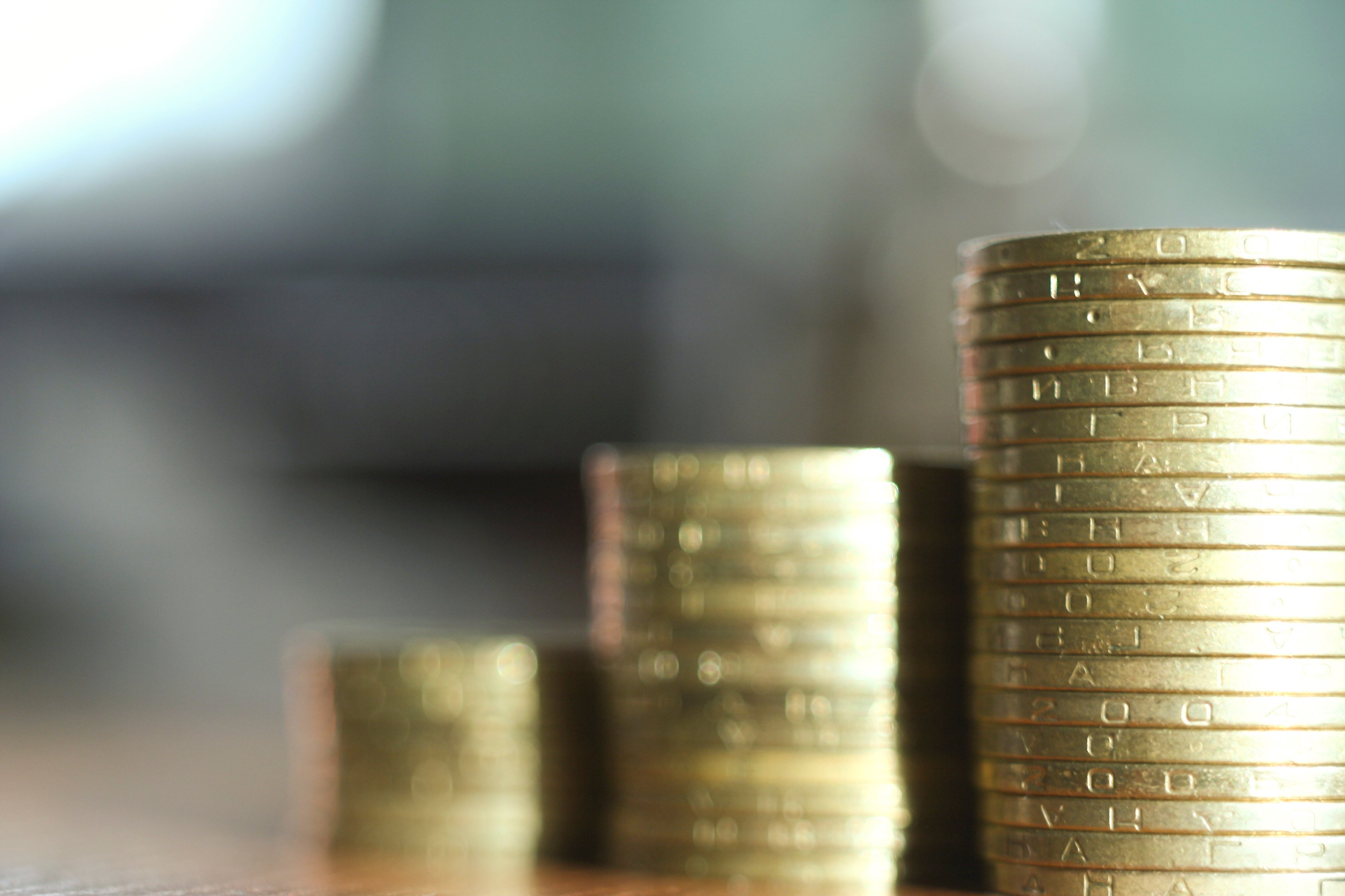 Three stacks of coins, ascending in size from left to right.