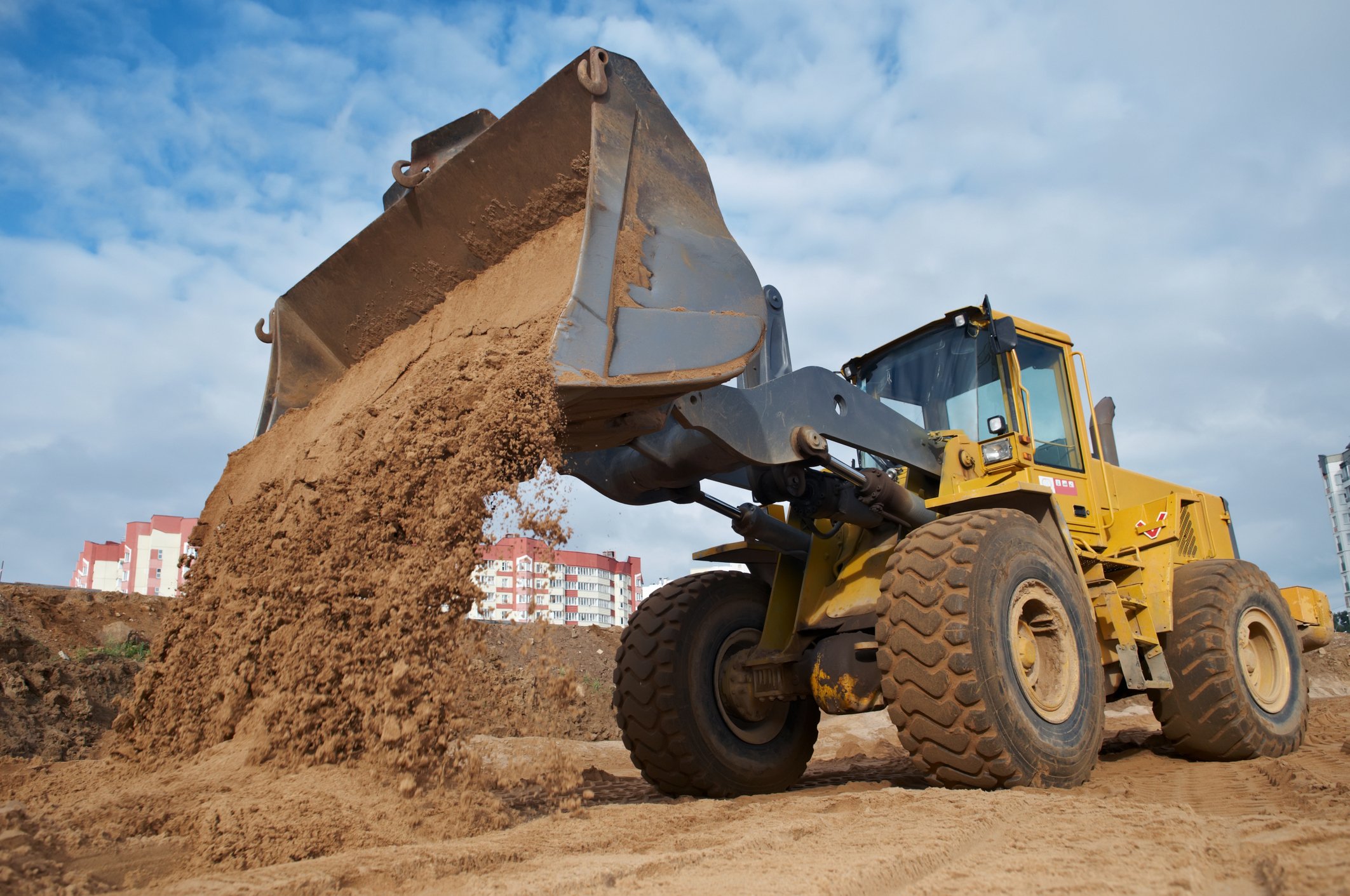 Bulldozer moving dirt. 