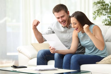 Man and woman happy look at paper