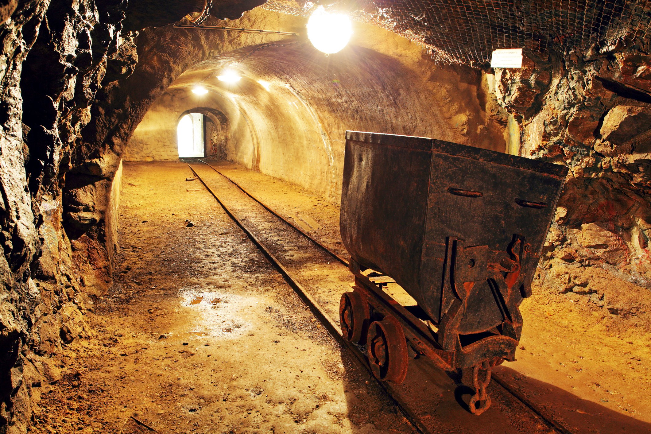 Gold mine underground with rail track. 