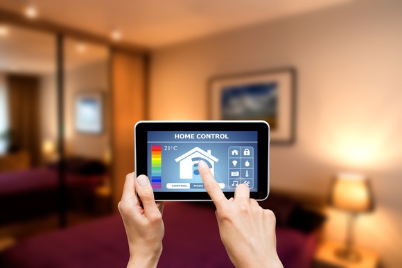Person controlling a smart home with a tablet