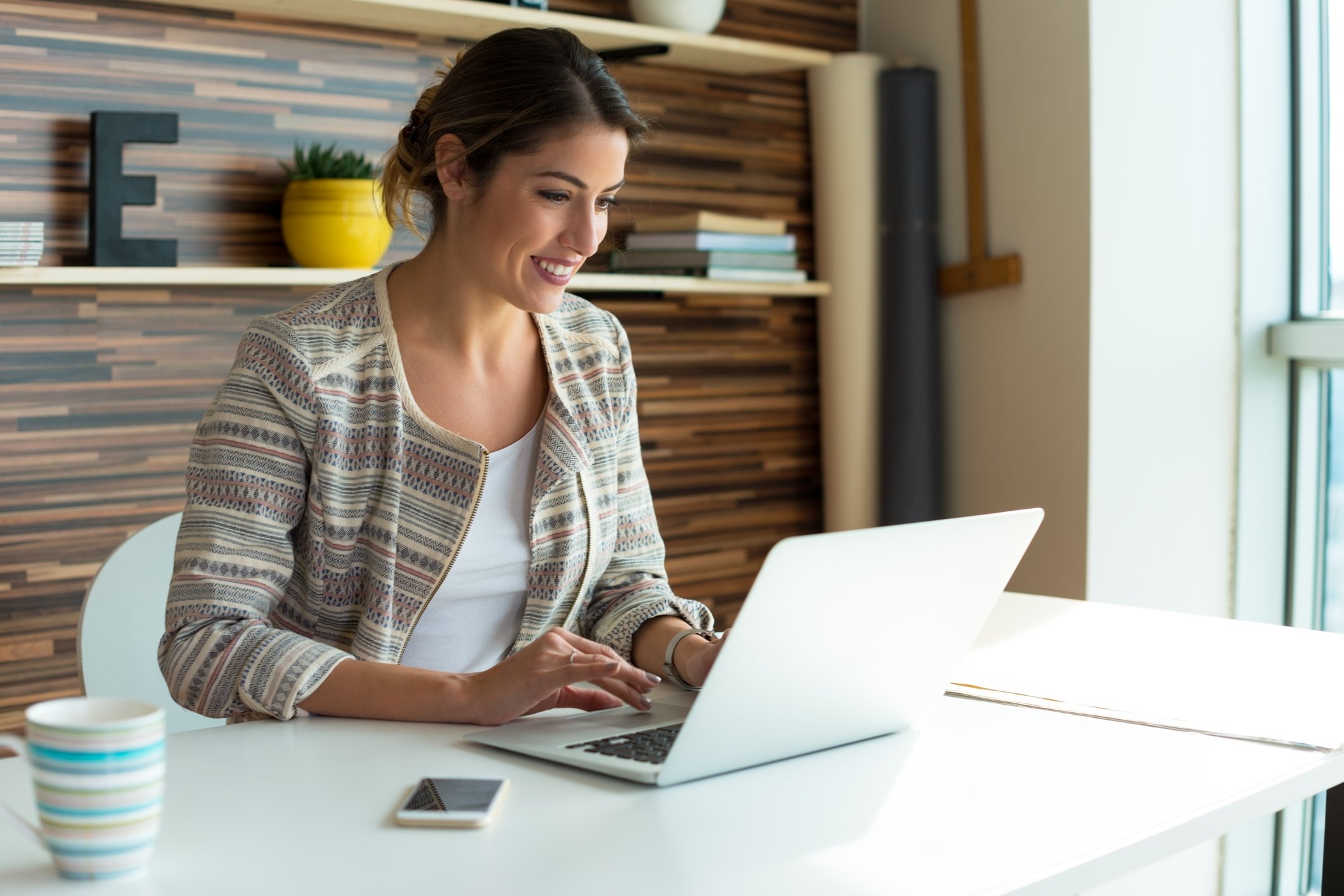 Woman typing on laptop