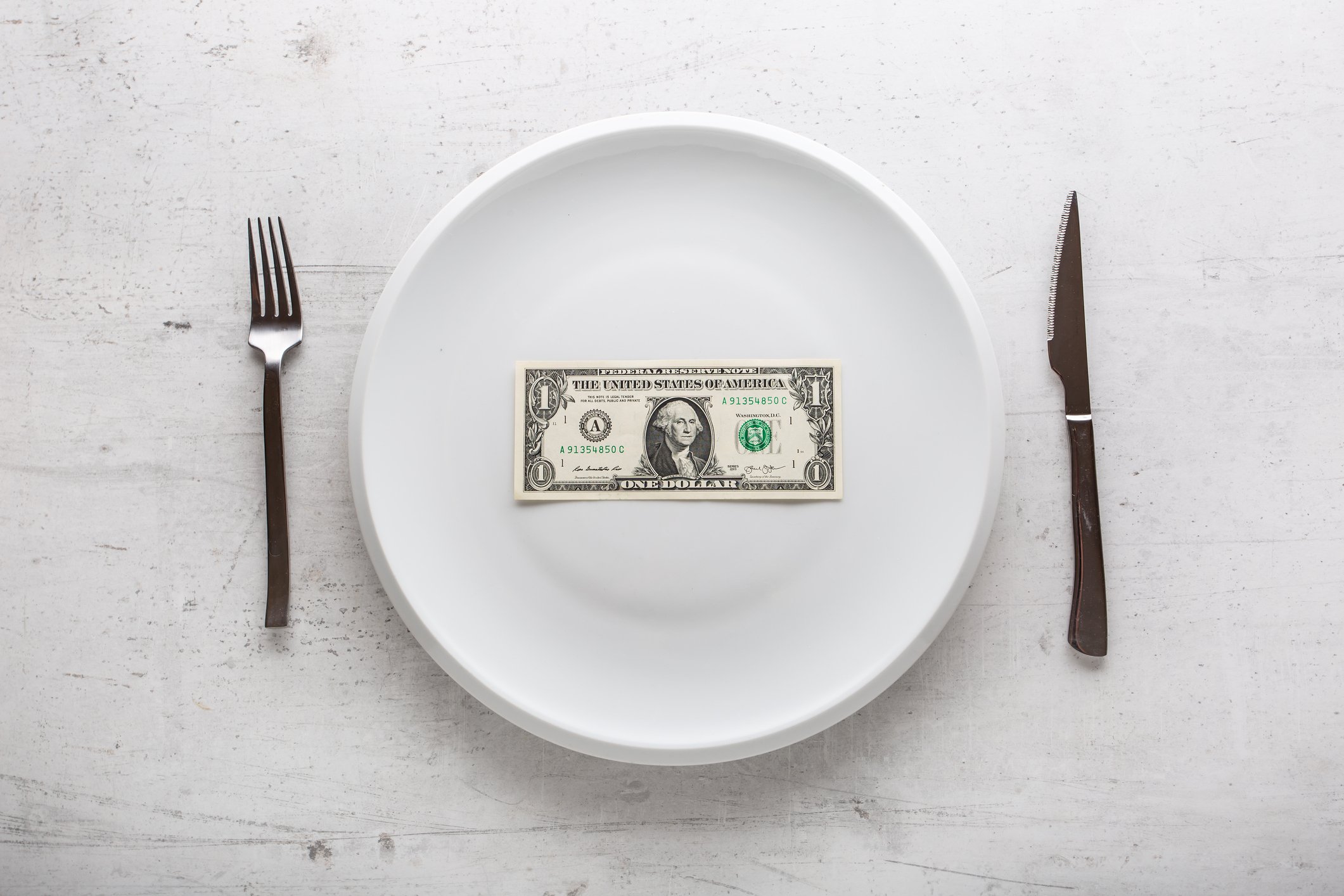 Dollar bill on plate