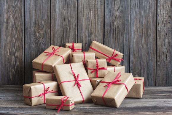 A pile of gift boxes tied with red ribbons.