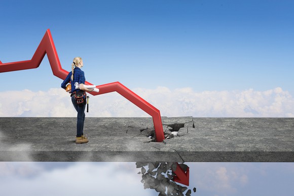 A person watches a red charting arrow crashing through a stone floor suspended in air. 