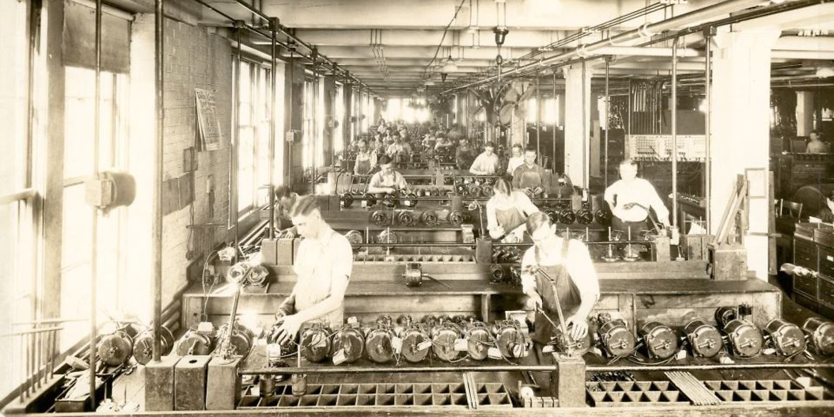 historical pic of men working in manufacturing at an Emerson Electric plant