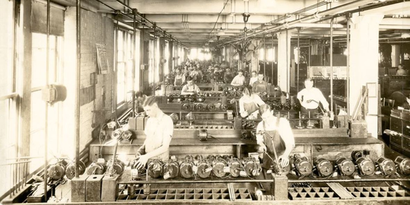 historical pic of men working in manufacturing at an Emerson Electric plant