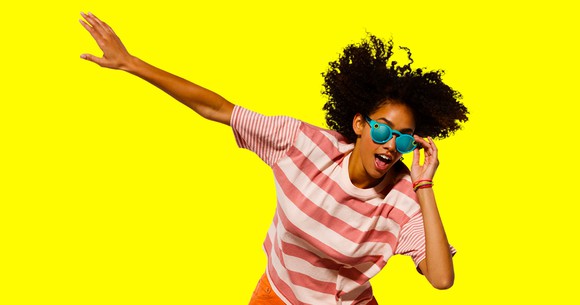 Person wearing Spectacles with a yellow background