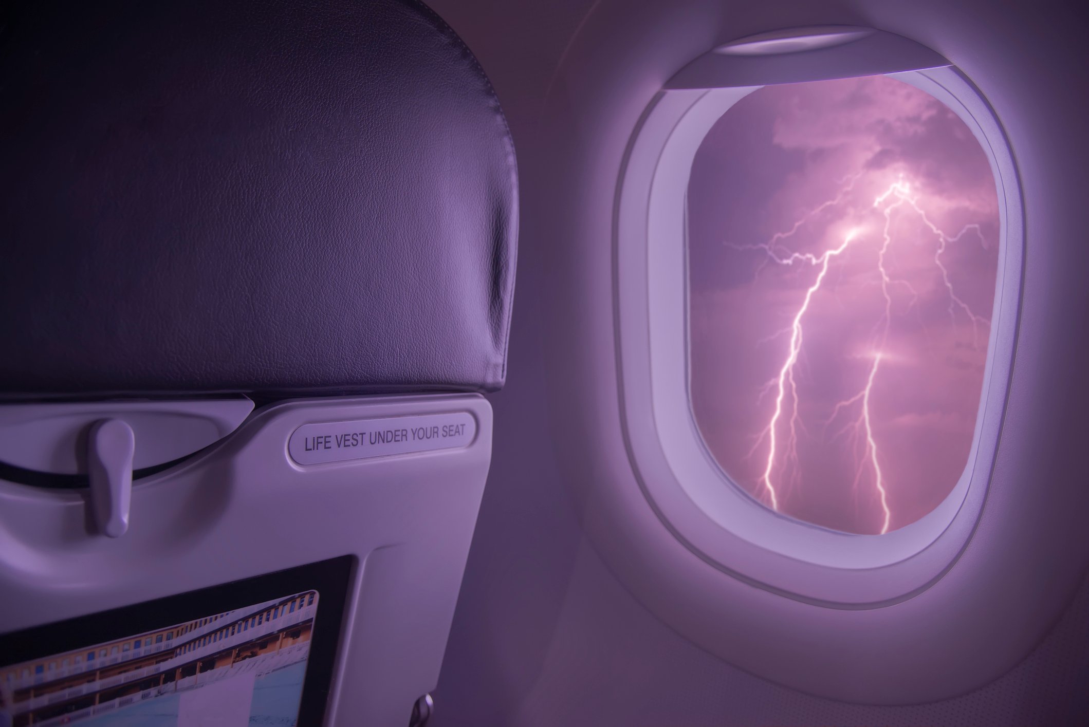 Lightning viewed from inside an airplane cabin