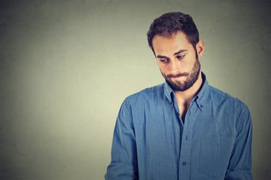 man looking sheepish_GettyImages-494215188