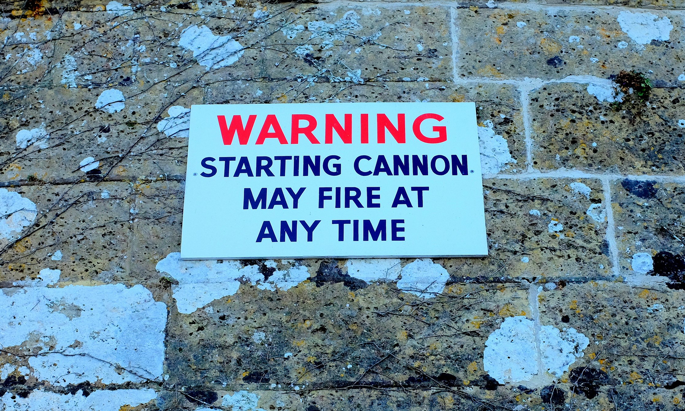 A sign that reads warning, starting cannon may fire at any time