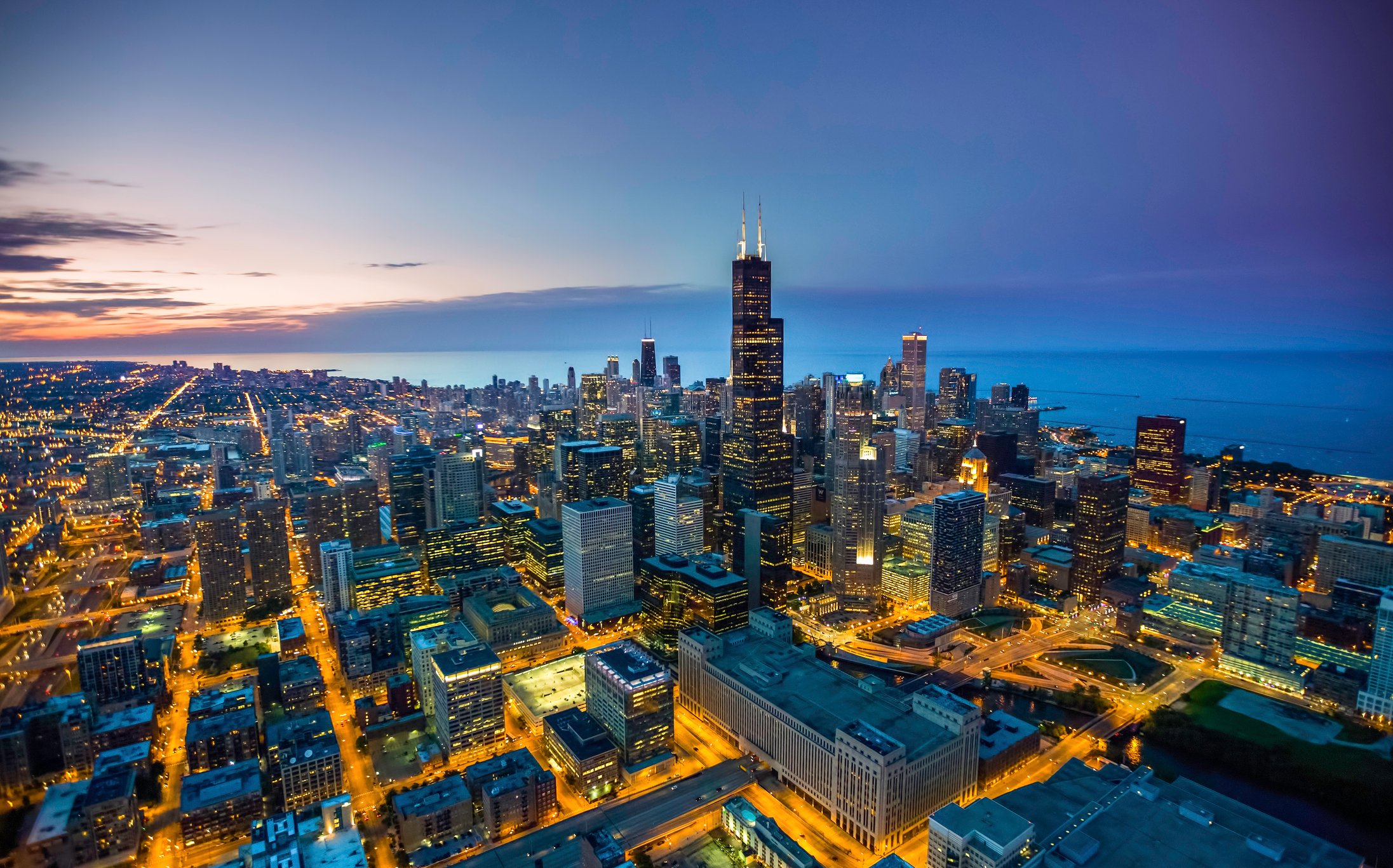 An aerial view of the Chicago skyline at dusk.