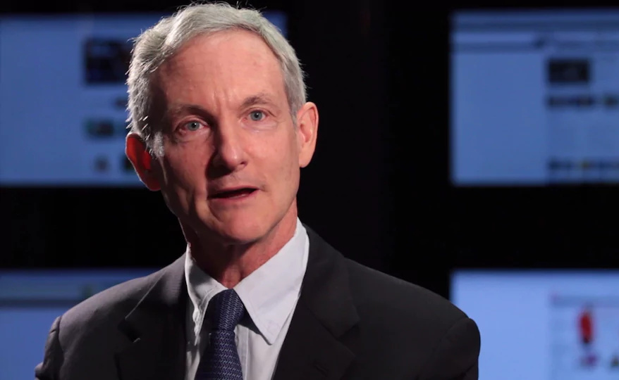 Headshot of CEO Tom Leighton wearing a dark business suit.