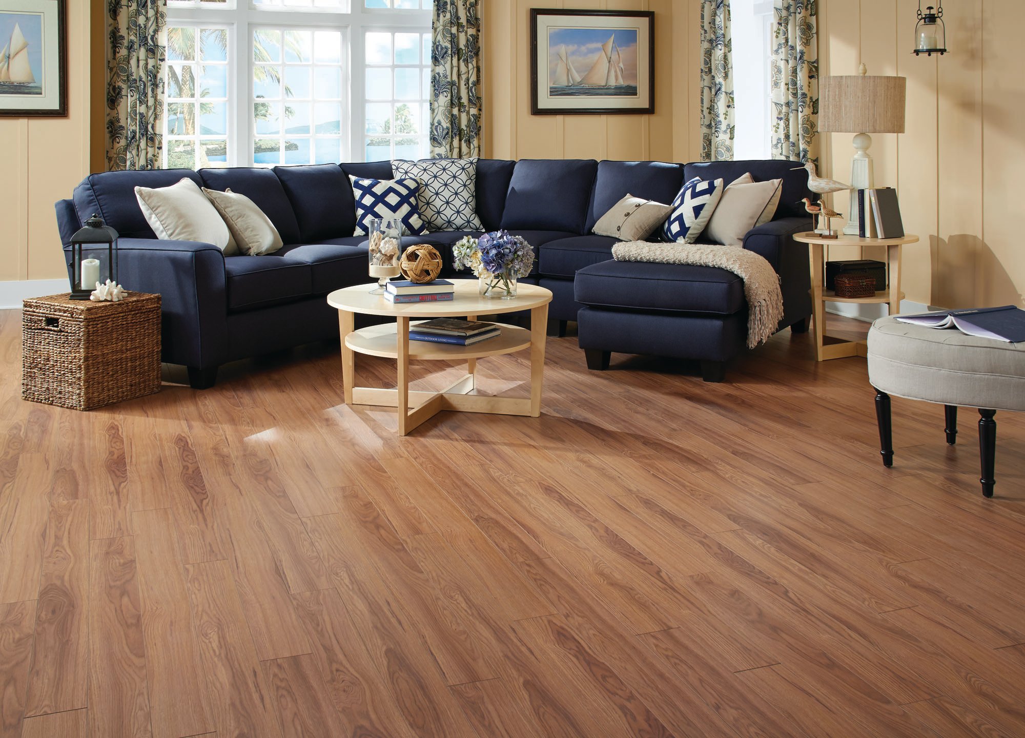 Room with blue couch and attractive hardwood floor