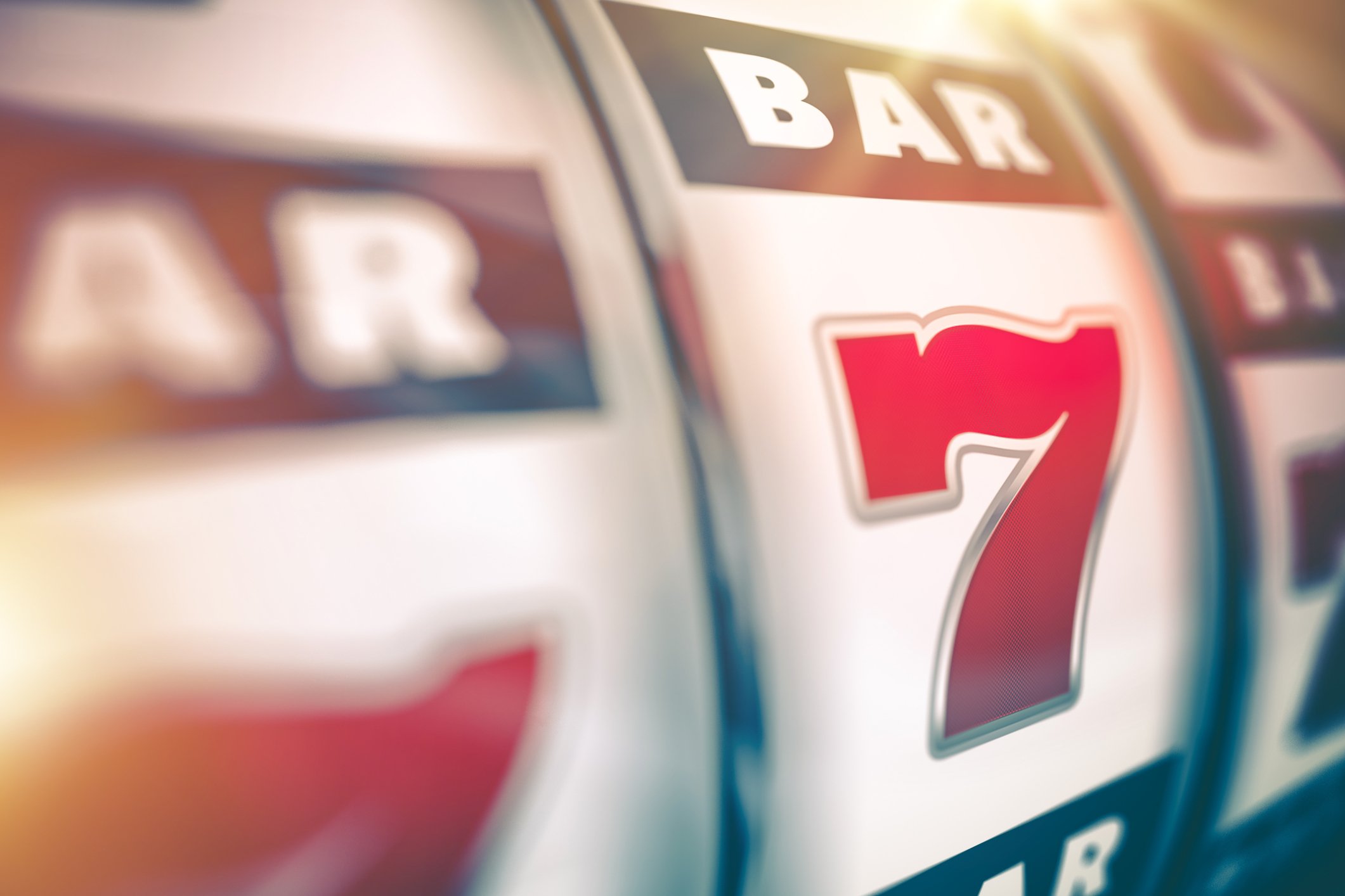 Slot machine showing all 7s. 