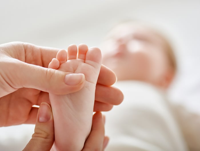 Doctor examining a baby's foot