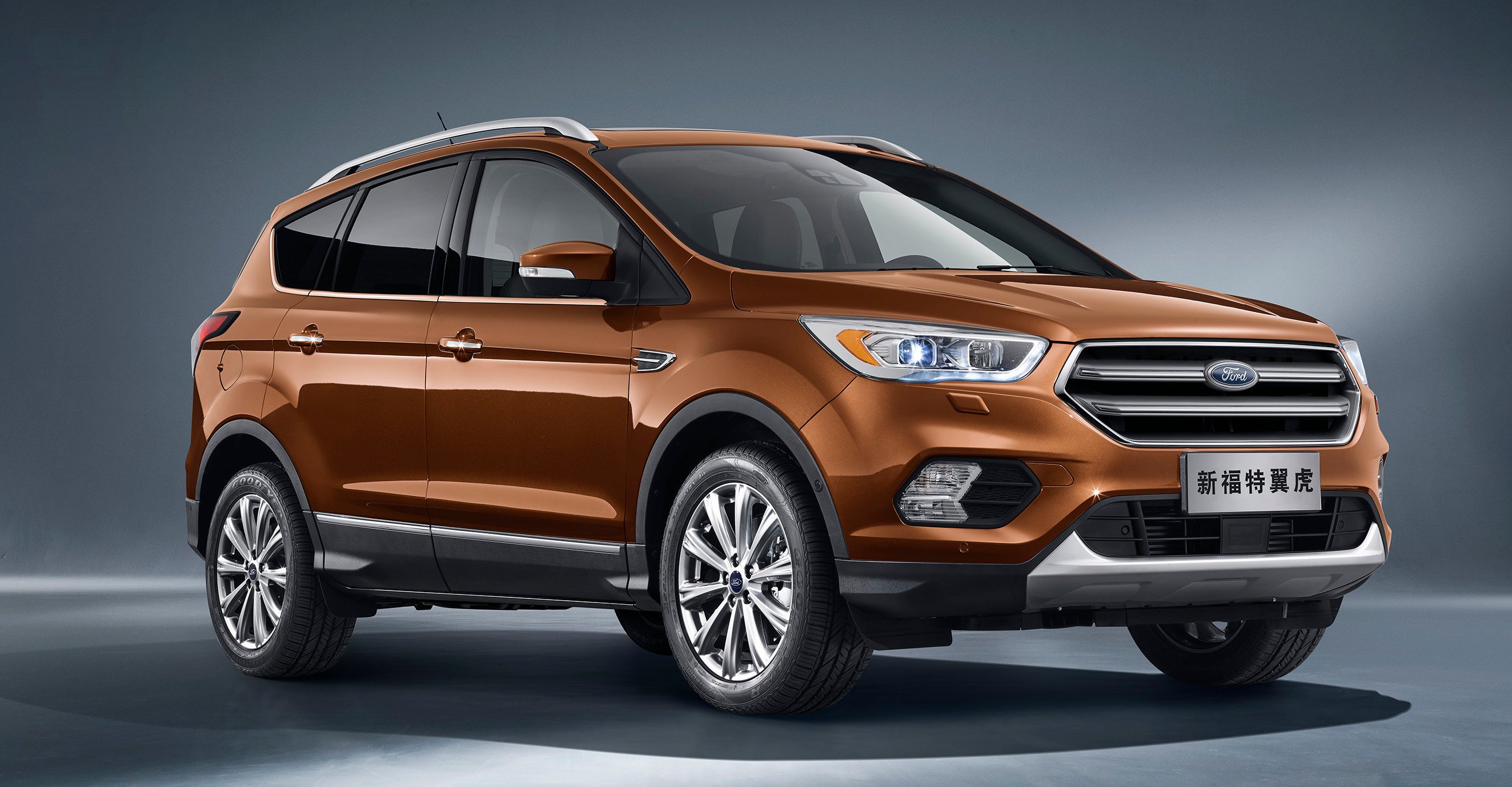 A brown 2017 Ford Kuga, a compact SUV, with Chinese license plates.