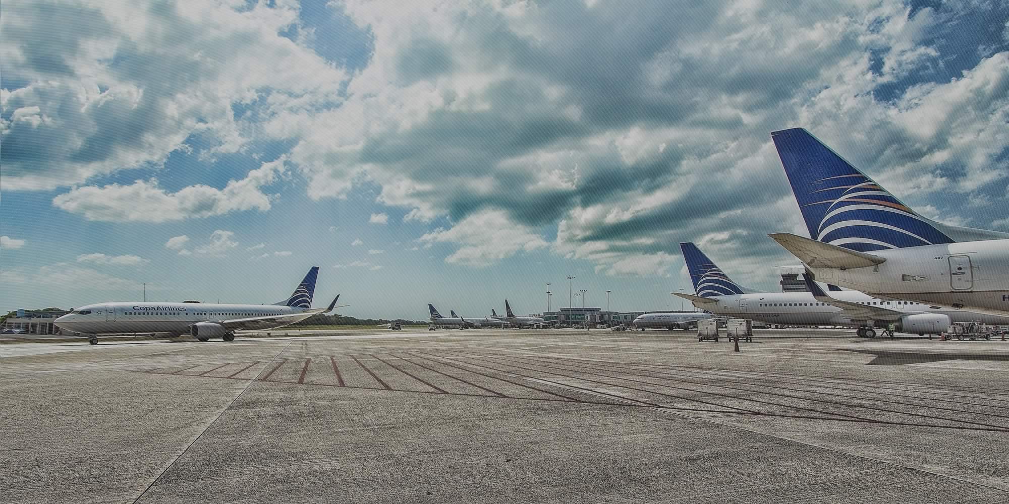 Several Copa Airlines planes sitting on the tarmac