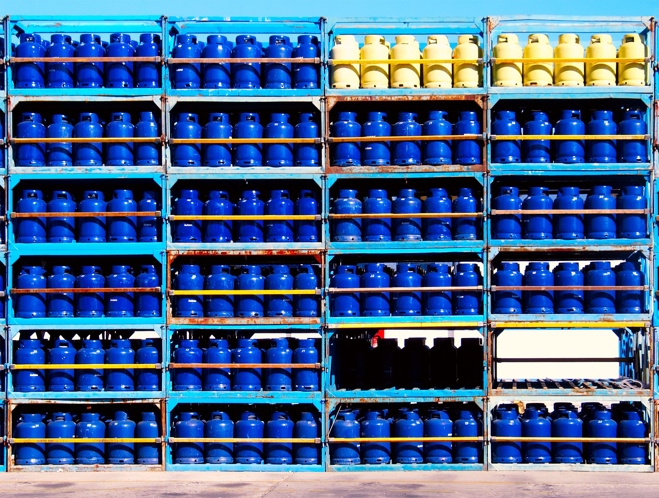 Propane tanks stacked on shelves