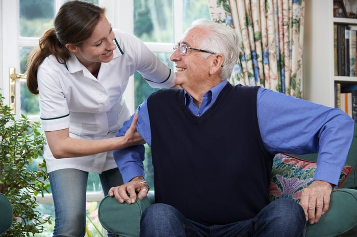 Assisted living caregiver with older man