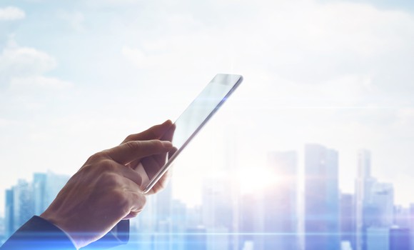 A man holding a tablet