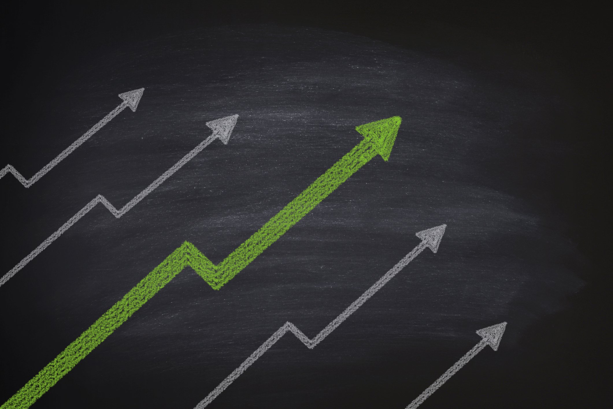 Arrows on a blackboard pointing up.