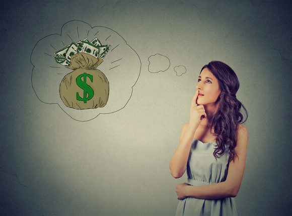 Woman thinking of money, as visualized by a thought bubble.