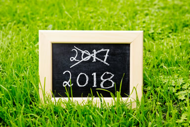 2017 crossed out with 2018 on chalkboard