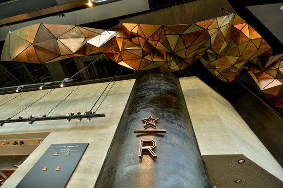 The Starbucks store in Hong Kong features geometric art hanging from the ceiling