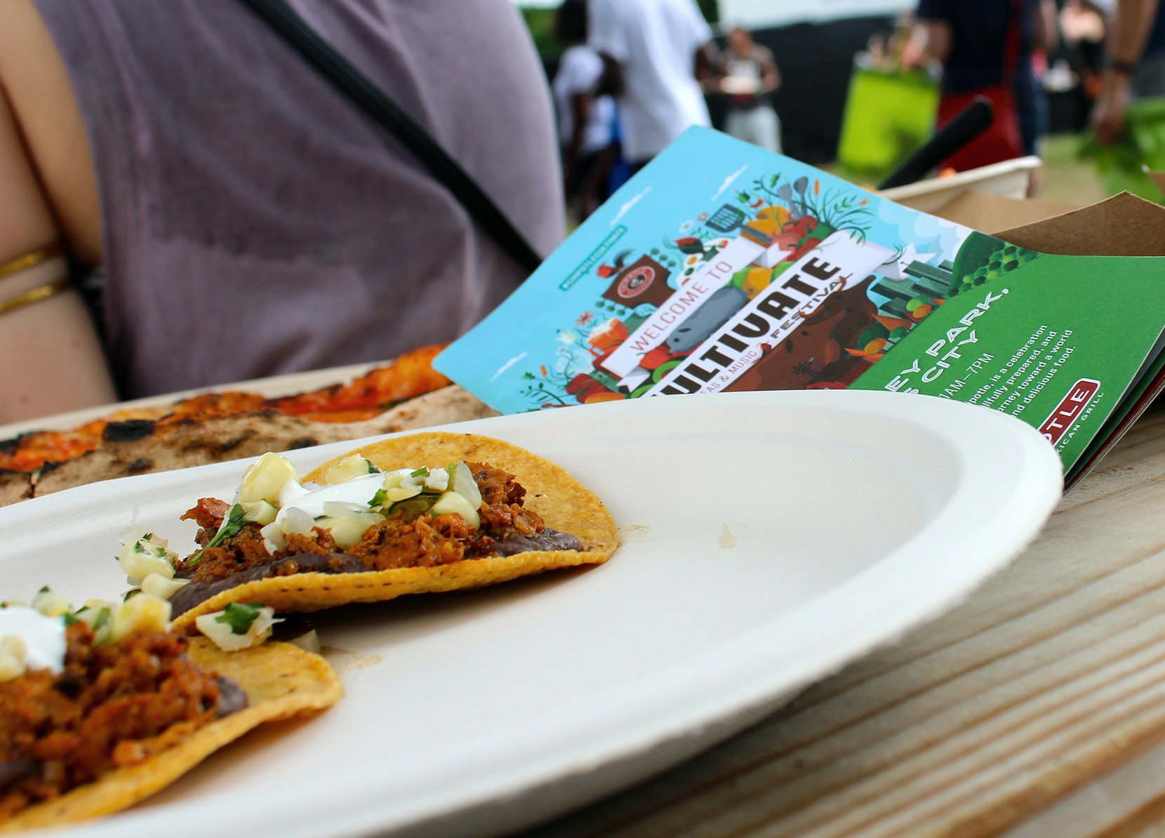 Tostada plate with a Chipotle flyer partially visible under the plate.