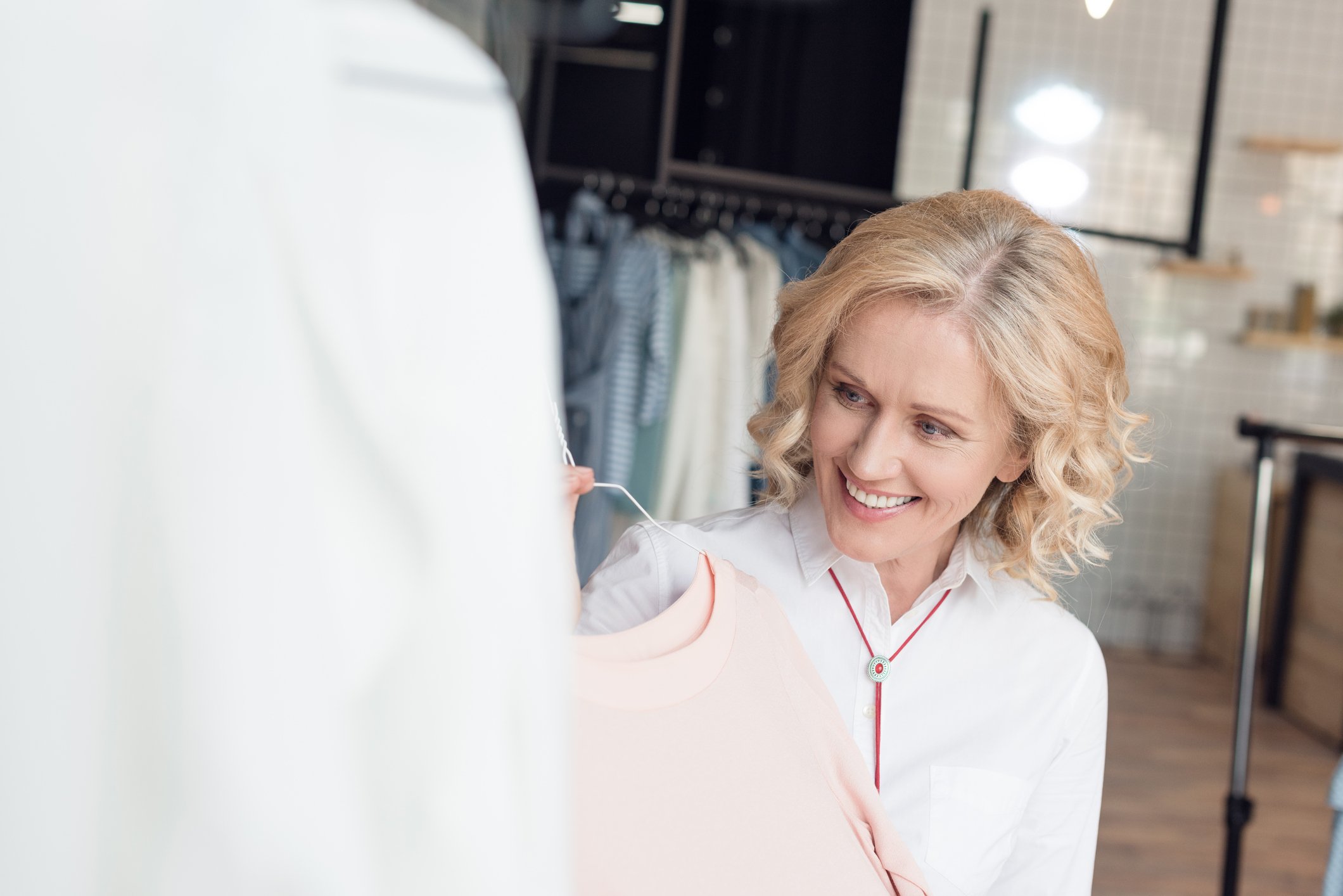 Woman choosing clothes in a clothing store