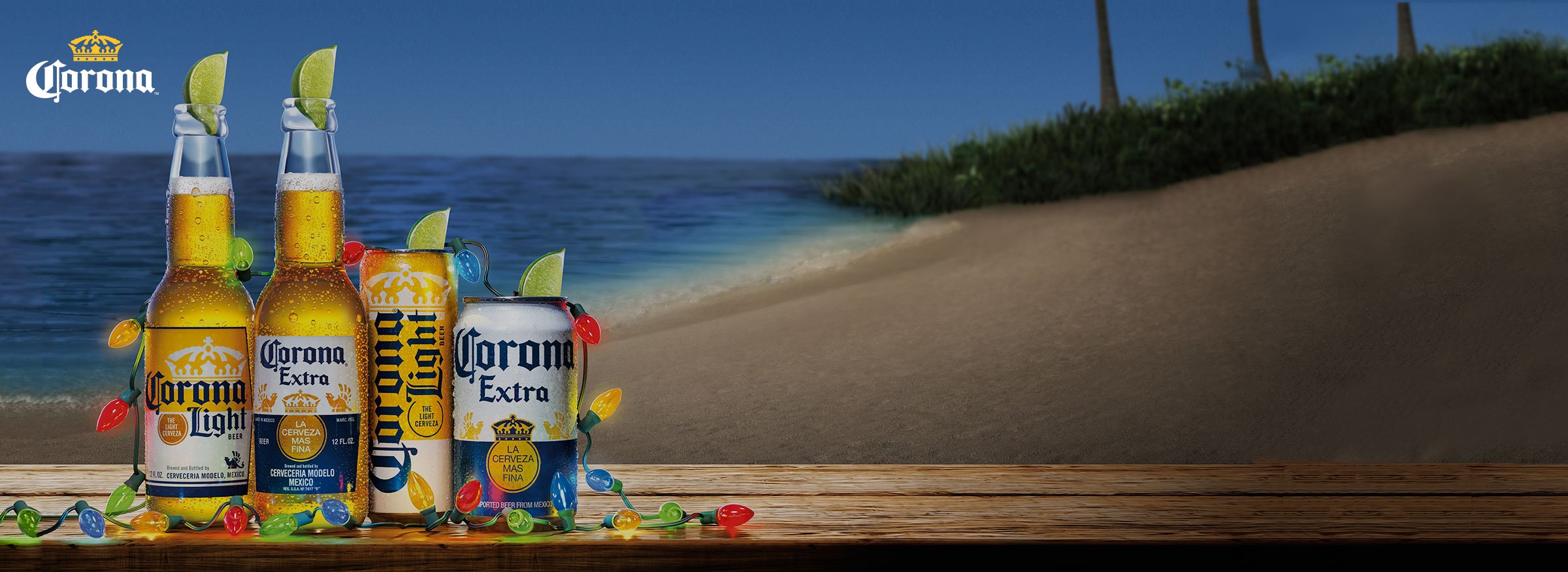 A row of Corona beverages decked with Christmas lights on the beach