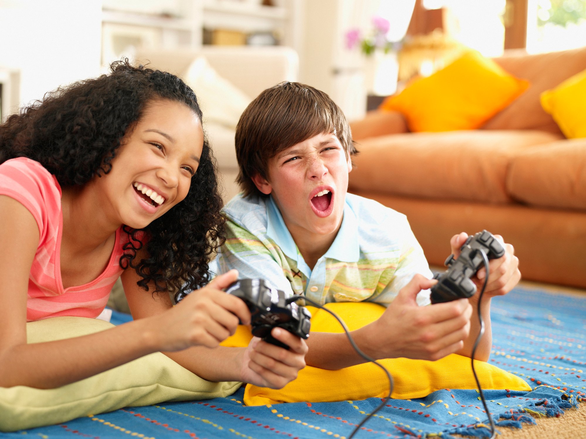 Two children play a console video game.