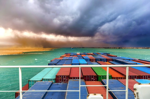 Containers on the deck of a ship heading into a storm