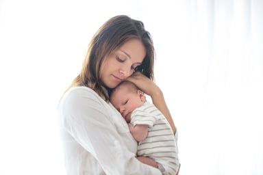 woman holding baby_GettyImages-845992464