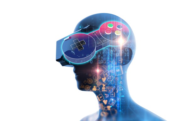 A computer generated person wearing a VR headset standing behind a video game controller.